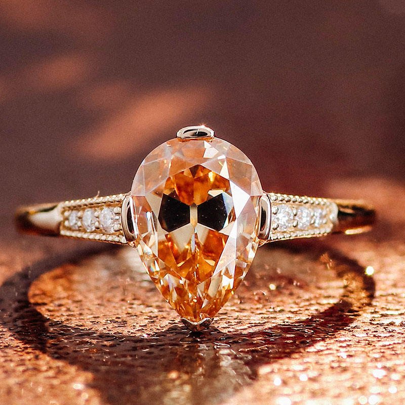 2.9 Ct Faint Orange Pear Moissanite With 6 Round Cut Diamonds Enagagement Ring