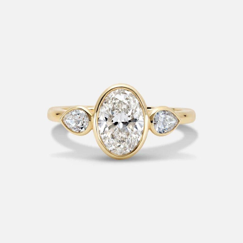 2.0 Ct Oval Moissanite With Pear In Side Wedding Ring